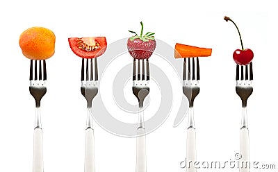 Red fruits and vegetables on the collection of forks Stock Photo