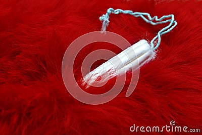 Red fur and menstrual tampon. Woman critical days, gynecological menstruation cycle. Menstruation sanitary feminine hygiene concep Stock Photo