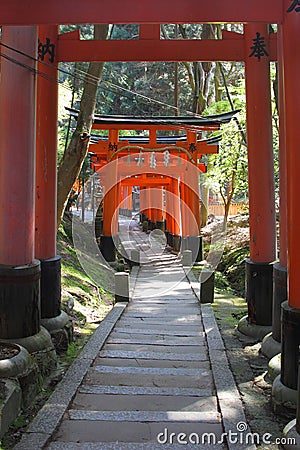 Red gates tunnel in Kyoto Stock Photo