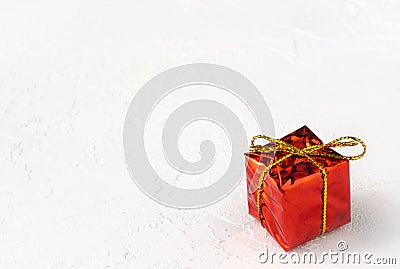 Red gift box with golden bow on white background Stock Photo