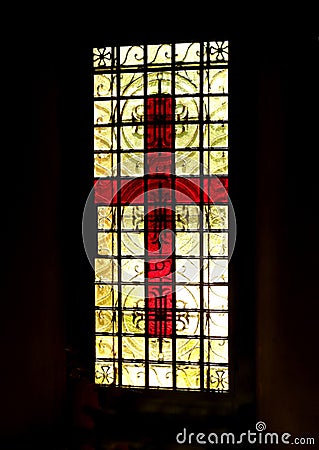 Red glass crucifix with black border Stock Photo