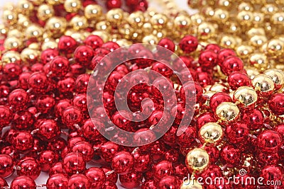 Red and Gold Holiday Bead Decortations. Christmas Background Stock Photo
