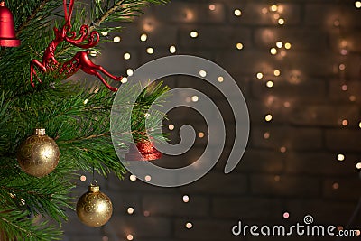 Red and gpld toys on a christmas tree Stock Photo