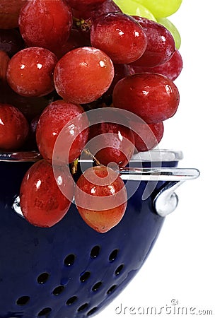 Red Grapes in Blue Colander Stock Photo