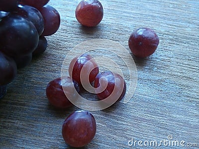 Red Grapes on wood Stock Photo