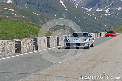 Red and gray Ferrari take part in the CAVALCADE 2018 event along the roads of Italy, France and Switzerland around MONTE BIANCO Editorial Stock Photo