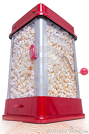 Red and gray full popcorn maker on table Stock Photo