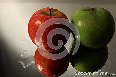 Two reflected apples & water with applying rule of thirds Stock Photo