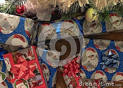 Wrapped Christmas gifts under the tree Stock Photo