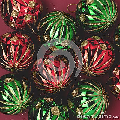 Red and green Christmas baubles. Festive texture. Stock Photo