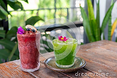 Red and green fruit smoothies in glasses Stock Photo