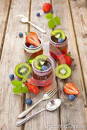 Red and green jelly served with fruit Stock Photo