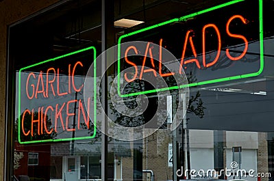 Red and green neon sign in window Stock Photo