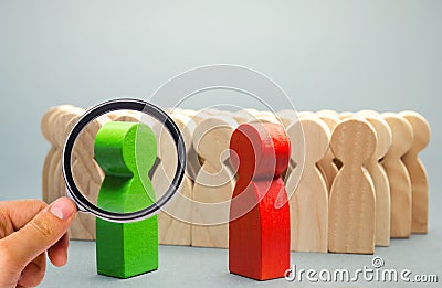 Red and green people stand in front of a crowd. Two opponents. Conflict of interest. Dispute. Search for compromises. Social Stock Photo