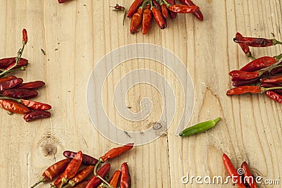 Red and green pepers spread across the table Stock Photo