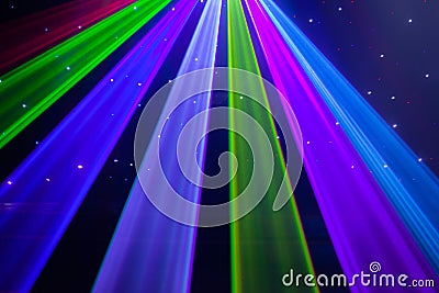 Red, green, purple, white, pink, blue laser lights cutting through smoke machine smoke Stock Photo