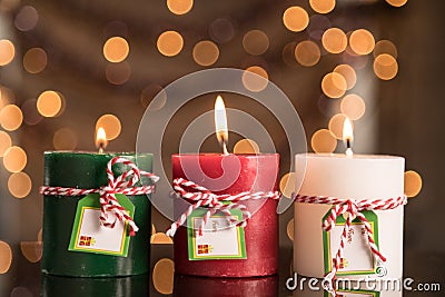 Red, Green And White Pillar Candle Abstract Blurred Christmas Ba Stock Photo