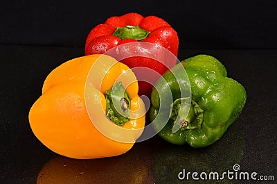 Red, Green and Yellow bell peppers Stock Photo