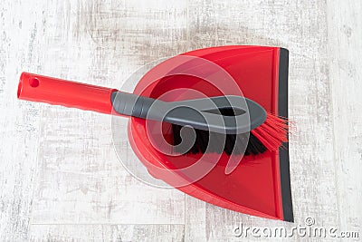 Red and grey dustpan and brush Stock Photo