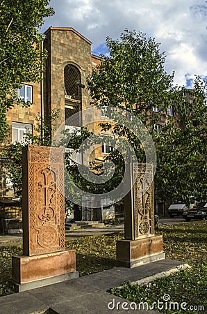 Two khachkars with carved patterns and crosses stand side by side in the Alley of stone crosses in Gyumri Stock Photo