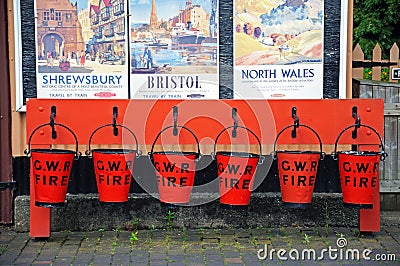 Red GWR fire buckets, Hampton Loade. Editorial Stock Photo