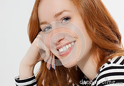 Red haired girl with close up macro face isolated on white background. Woman beauty and skin care. No make up concept. Redhead Stock Photo