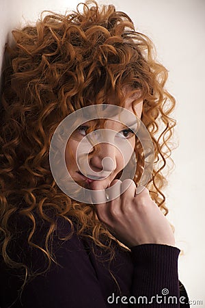 The red-haired girl posing in the studio 5 Stock Photo