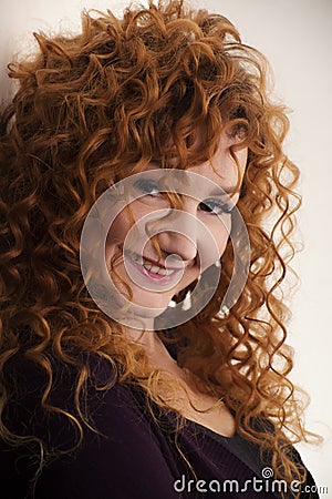 The red-haired girl posing in the studio 6 Stock Photo