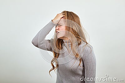 Red haired woman in gray sweater shows the emotion of grief trouble problems Stock Photo