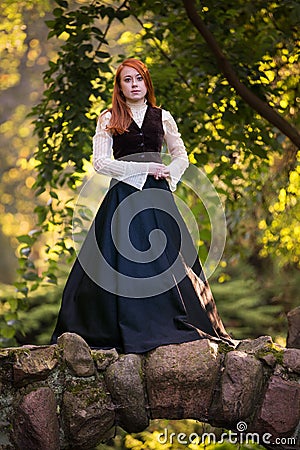 Red-haired woman in Victorian outfit Stock Photo