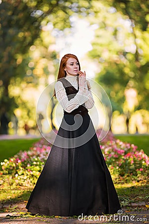 Red-haired woman in Victorian outfit Stock Photo