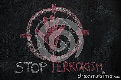 Red hand shape and stop terrorism text in the sign target on black chalkboard Stock Photo