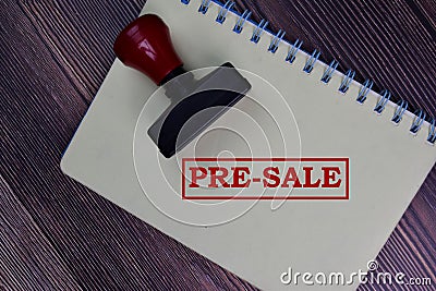 Red Handle Rubber Stamper and Pre-Sale text isolated on the table Stock Photo