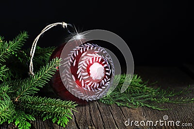Red Handpainted Christmas Ornament with Evergreen Stock Photo