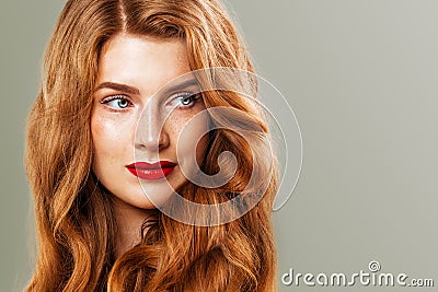 Red head woman with freckles and ginger hair. Natural redhead girl, beautiful female model face closeup Stock Photo