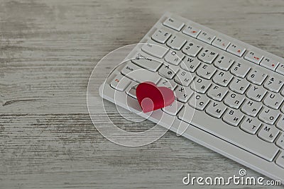 Red heart on computer keyboard Stock Photo