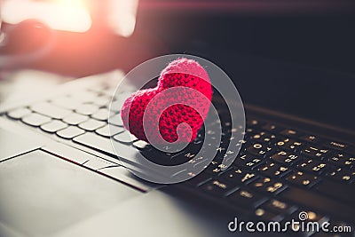 Love chat online dating heart on laptop keyboard Stock Photo