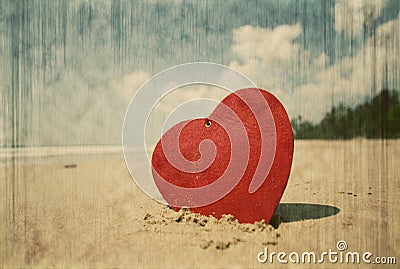 Red heart on exotic sandy beach Stock Photo