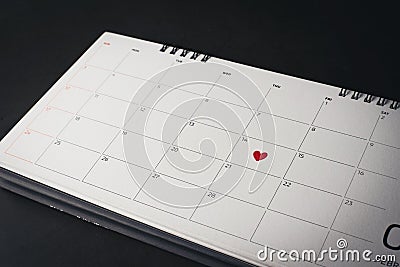 Red Heart in February 14 on the calendar, Valentine`s day Stock Photo