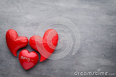 Red heart on the gray background. Stock Photo