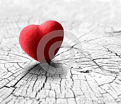 Red heart on grey textured wood background. Valentine`s day ornament Stock Photo