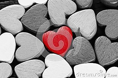 Red heart and many black and white hearts. Stock Photo