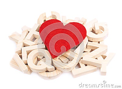 Red heart over the pile of wooden letters Stock Photo