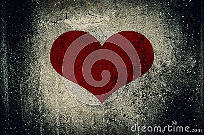 Red heart painted on grunge cement wall background Stock Photo