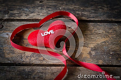 Red heart with ribbon on wooden background, Valentines Day bac Stock Photo