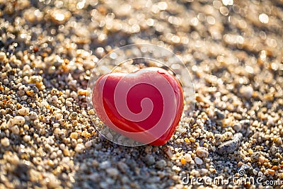 Red heart by the sea, romantic, in love, lost, holiday Stock Photo