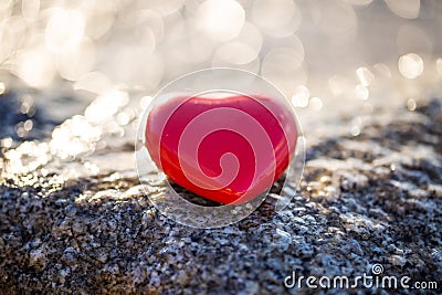 Red heart by the sea, romantic, in love, lost, holiday Stock Photo