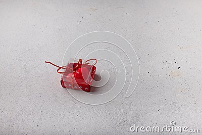 Red heart-shaped candle in box on white background. Small Valentines day present, symbol or souvenir. Copy space Stock Photo