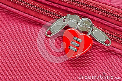 Red heart shaped lock with code locking fabric suitcase luggage Stock Photo