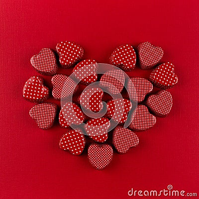 Red heart of small hearts on deep red paper background. Valentine day. Stock Photo